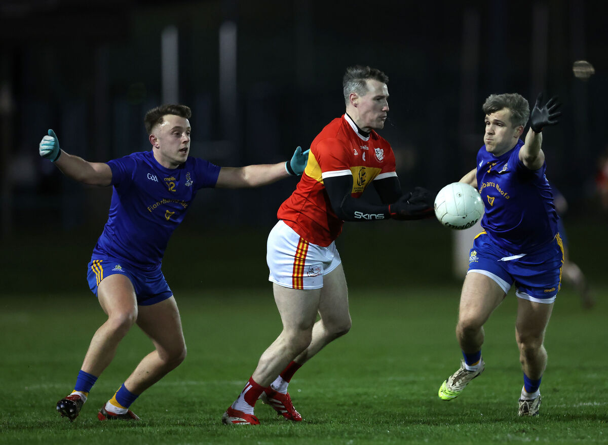  Adam Lyne and Bill O'Connell of St Finbarr's put the pressure on Mark Griffin of Éire Óg. Picture: Jim Coughlan