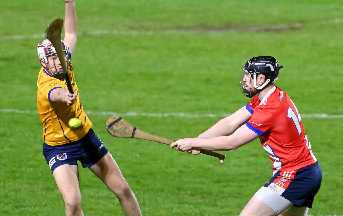  MTU's Luke Keating shoots past DCU's Billy Fitzpatrick during the All-Ireland Junior Hurling final at the MTU sports grounds. Picture: David Keane.