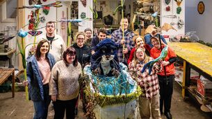 <p>Members of the Brothers of Charity group pictured with their colourful creations at a Community Art Link workshop in Blackpool where final touches are being put on floats for this year’s St Patrick’s Day parade, including dragonflies, fish and bats circling a pond complete with a cheeky pop-up otter. Picture Chani Anderson</p>