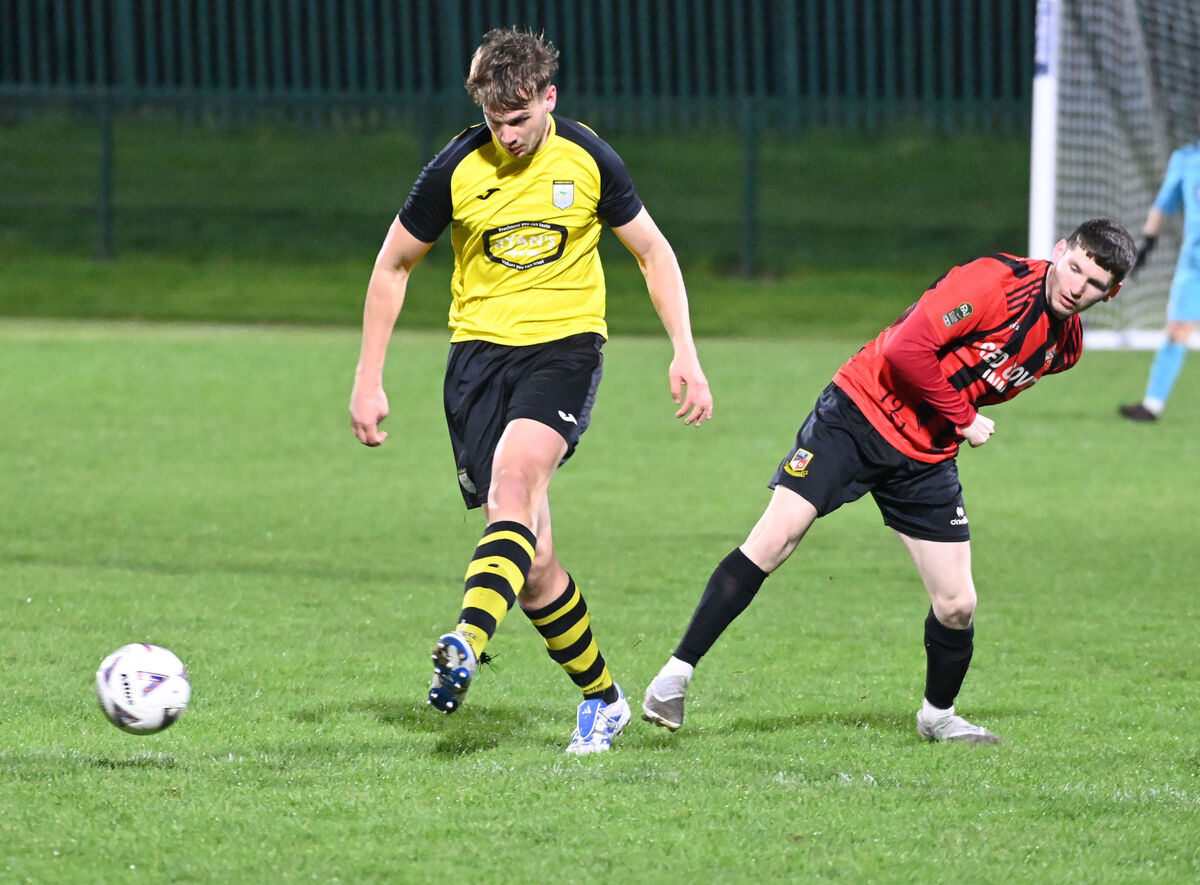Riverstown's Fionn O'Sullivan clears from Ringmahon Rangers' Kalem Cashman during the Beamish Stout MSL junior premier game at Ringmahon Park. Picture; Eddie O'Hare