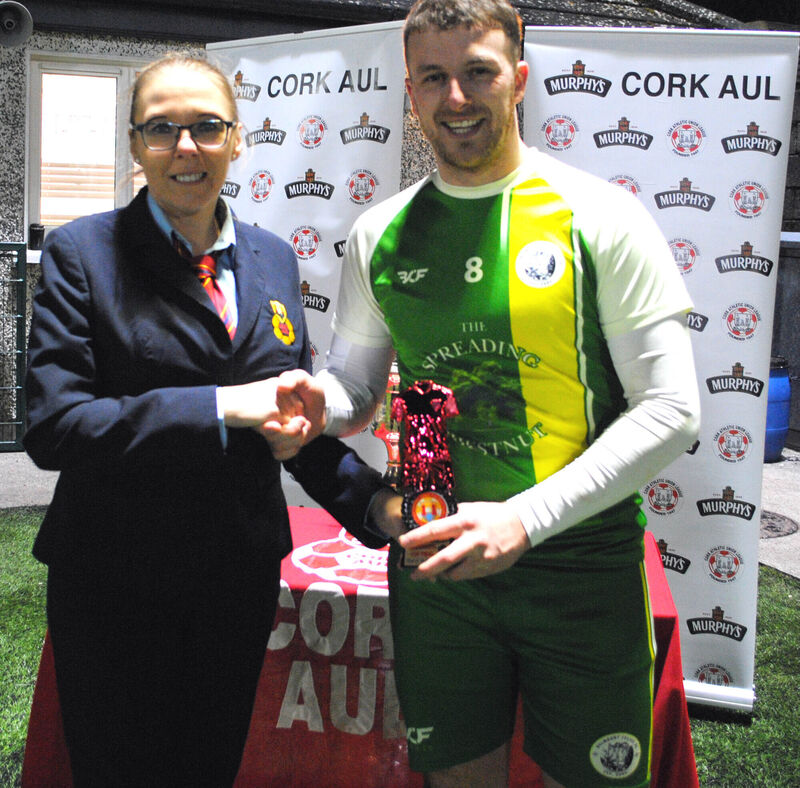 Bríd Cantillon (Cork AUL) presents the Man of the Match award, sponsored by Gary McCarthy Trophies, to Jonathon Buckley. Picture: Barry Peelo.