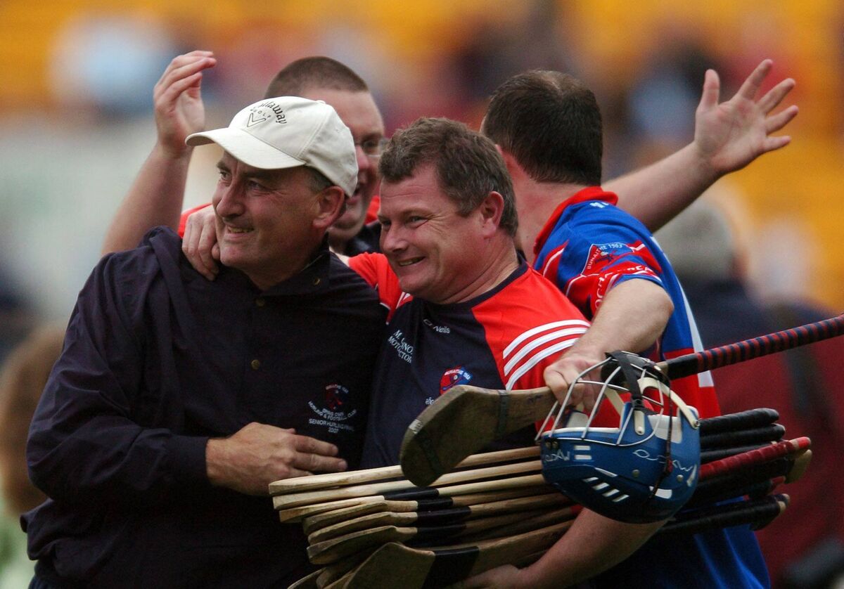 Erin's Own coach PJ Murphy and being congratulated at the final whistle in the Evening Echo Cork County S.H.C. final at Pairc Ui Chaoimh.