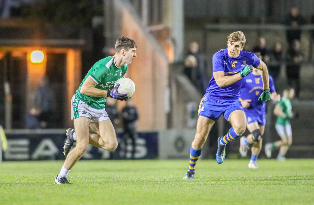 Seán Dore of Ballincollig is chased by St Finbarr's Ian Maguire in 2024. Picture: David Creedon