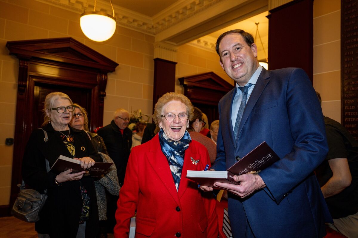 Mary Foley gets a copy of 'Got Cork' signed by author and former lord mayor of Cork, councillor Kieran McCarthy at the book’s launch at City Hall. Picture: Chani Anderson