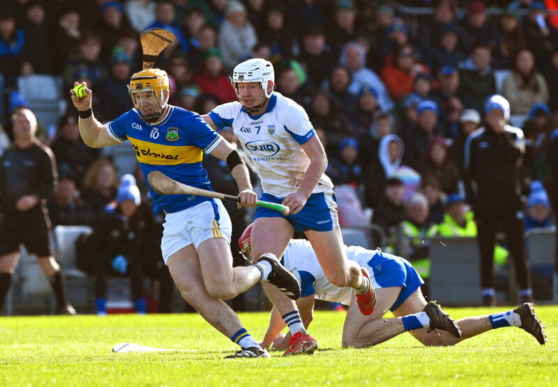Jake Morris of Tipperary is tackled by Shane Bennett of Waterford in Sunday's game at Azzurri Walsh Park. Picture: Ray McManus/Sportsfile