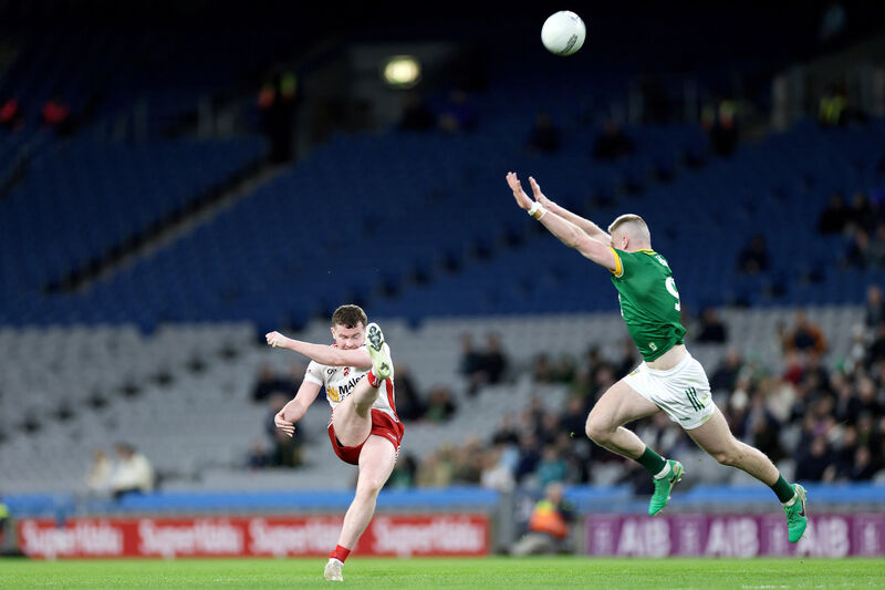 Tyrone's Ethan Jordan scores a two-pointer despite Jack Flynn of Meath. Picture: INPHO/Laszlo Geczo