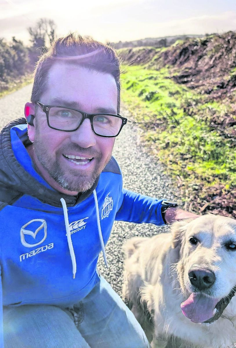 Paul Heron with his dog, Aussie. “I grew up in Melbourne and never imagined I’d be walking through woods in East Cork with a golden retriever as my sidekick,” he laughs