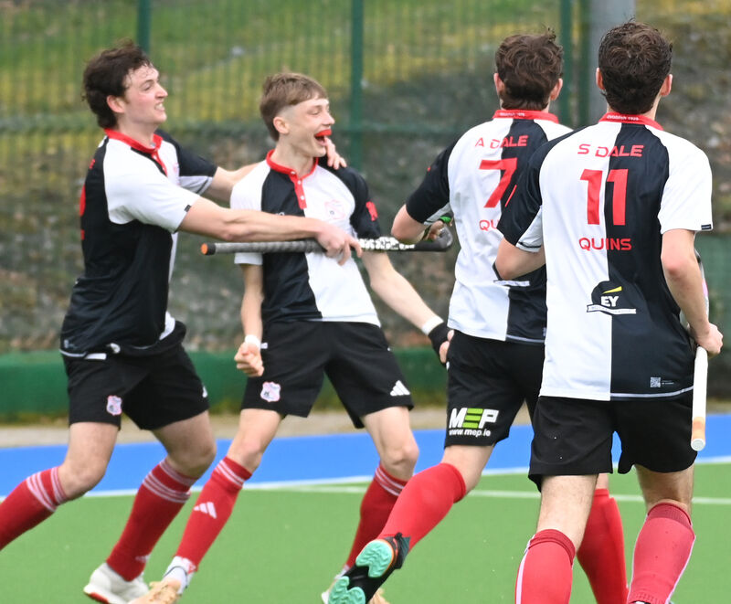 Harlequins' Charlie Bateman (second left) celebrates the equalising goal against Catholic Institute during the Men's Munster Senior Cup final at Garryduff. Picture: Eddie O'Hare