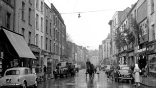 <p class="contextmenu internal_Caption">A wet North Main Street in Cork city in December,1955. Guy’s Directory from 1875 lists all the many shops that occupied the street then</p>