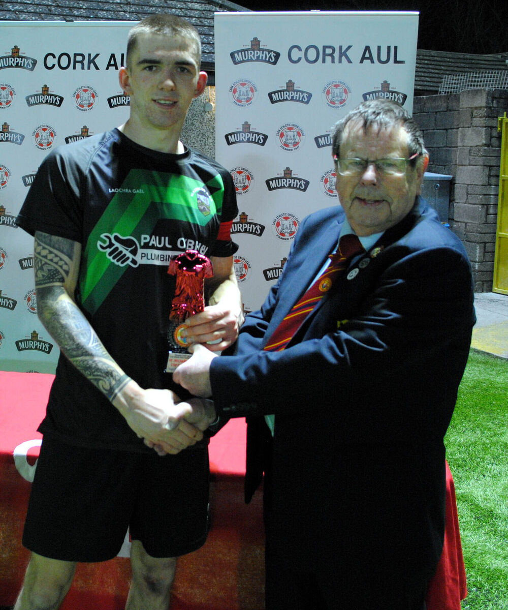 Tom Fitzgerald (Cork AUL) presents the Man of the Match award (sponsored by Gary McCarthy Trophies) to Waterloo's Jack Homan. Picture: Barry Peelo.