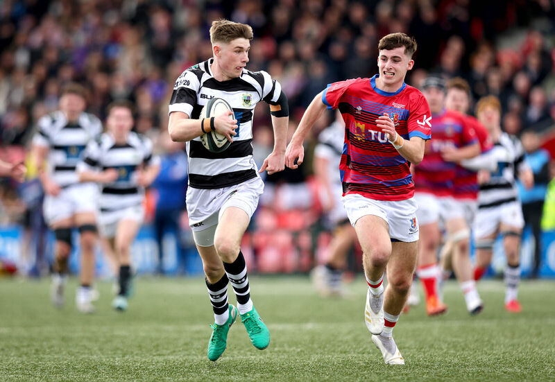 PBC’s Alex Moloney skips past St. Munchin's Oisin Madden on his way to scoring a try. Pic: INPHO/Ryan Byrne PBC’s Alex Moloney skips past St. Munchin's Oisin Madden on his way to scoring a try. Pic: INPHO/Ryan Byrne