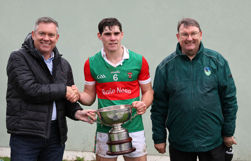  Bryan O'Donovan, MJK Oils, presents the cup to Shane Kingston, Ballinora, also included is John Feeney, Muskerry GAA chairman after the Muskerry JAHC final last year. Picture: Jim Coughlan