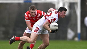 <p>Mark Cronin of Cork is tackled by Ryan Burns of Louth during the Allianz FL Division 2 game in Ardee. Picture: Ben McShane/Sportsfile</p>