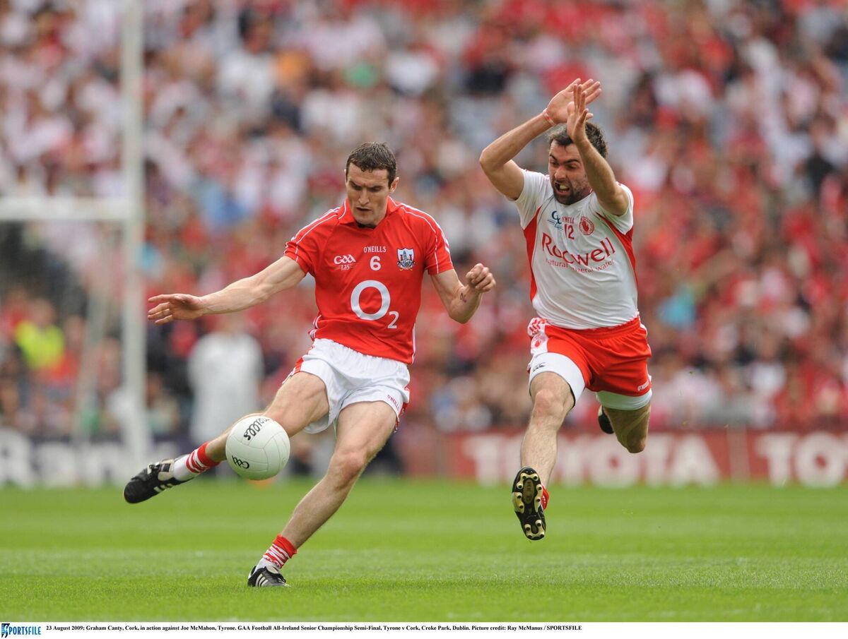 Cork's Graham Canty clears the ball as Joe McMahon of Tyrone closes in. Picture: Ray McManus/Sportsfile