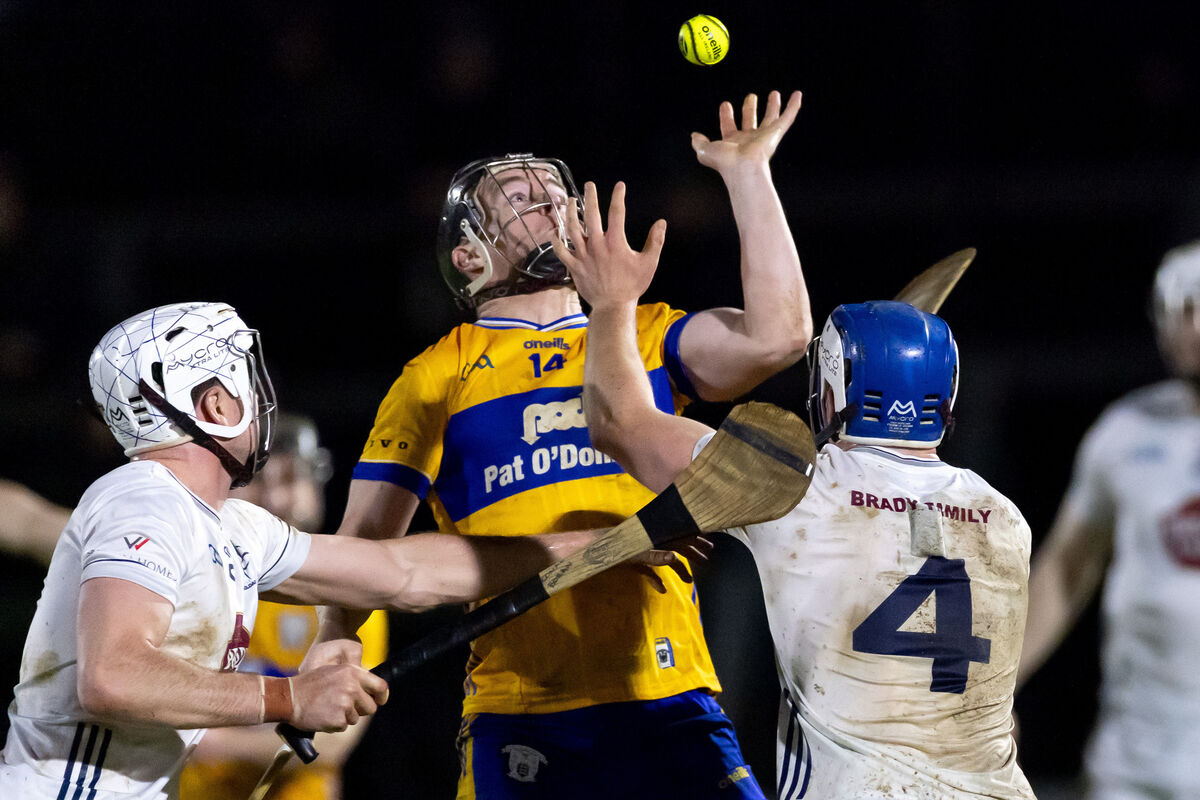 Kildare’s Dan O’Meara and Conor Boran with Tony Kelly of Clare. Picture: INPHO/Morgan Treacy