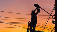 Silhouette of Electrician checking lighting to the LED street lamp post, Technician with clipping path and maintenance service c
