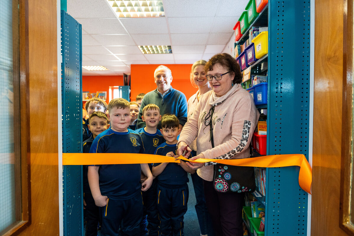Original school librarian Eleanor Murray cutting the ribbon. Original school librarian Eleanor Murray cutting the ribbon.