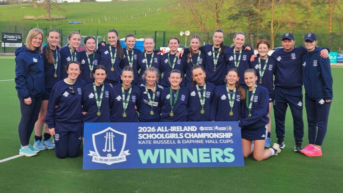 Scoil Mhuire players and management celebrate after winning the Daphne Hall Cup in Armagh on Friday.