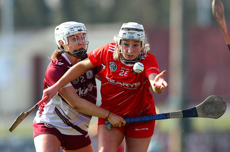 Cork's Ava McAuliffe passes from Rachael Hanniffy of Galway. Picture: INPHO/Tom O’Hanlon