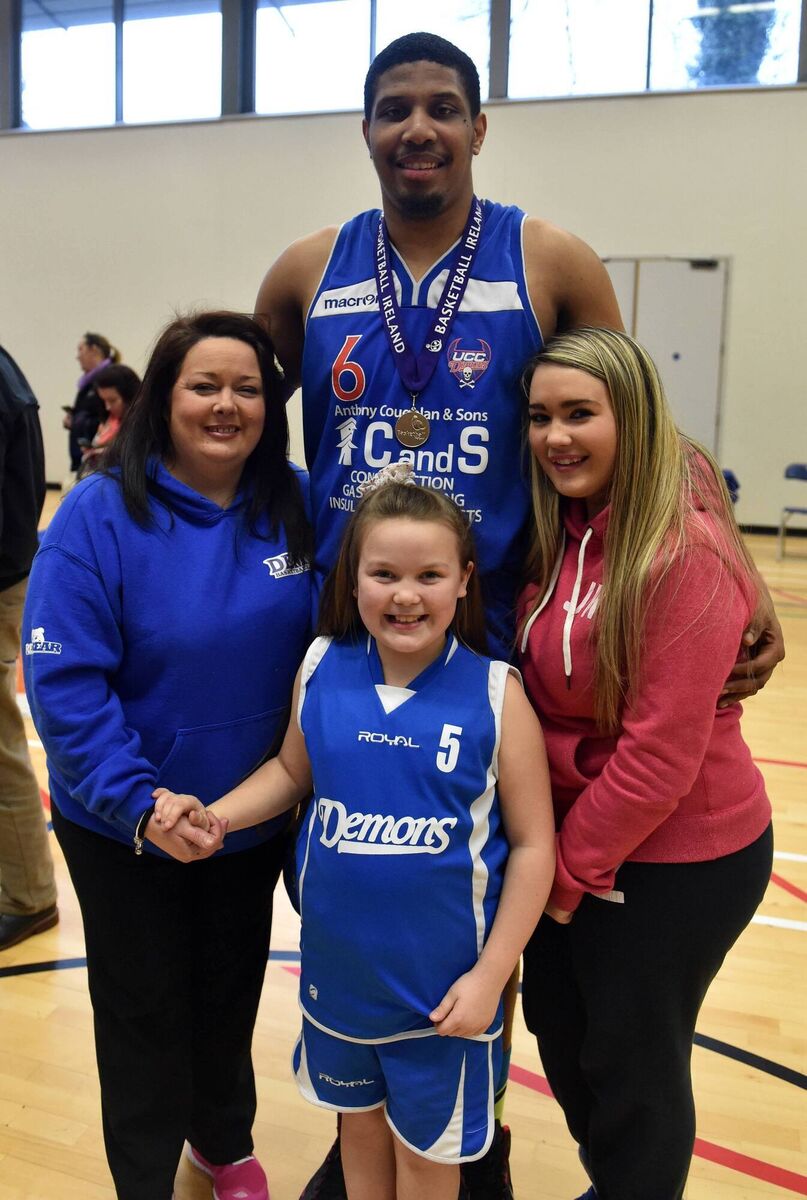 C &amp; S UCC Demons Lehmon Colbert with Geraldine, Aisling and Aine Murray after winning the men's premier league trophy at The Mardyke arena. Picture: Eddie O'Hare