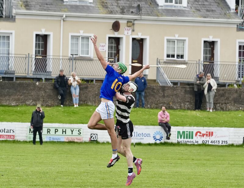 MY BALL: Ben Cunningham of the Barrs competes with Tadhg O’Leary Hayes of Midelton for possession. Picture: Noel Sweeney