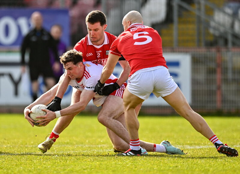 Ronan Cassidy of Tyrone in action against Maurice Shanley and Brian O'Driscoll of Cork. Picture: Oliver McVeigh/Sportsfile