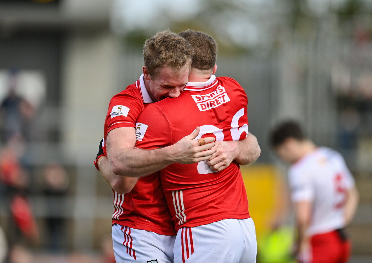 Ruairí Deane of Cork celebrates with Brian Hurley after promotion was sealed. Picture: Oliver McVeigh/Sportsfile