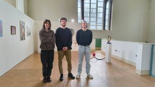<p>Gergely Somerville, Ailbhe Reilly-Tuite, and Aron O’Connell are the organisers of the Open Walls exhibition currently running at St Peter’s on Cork’s North Main St. Picture: Akash Kumar Sharma.</p>