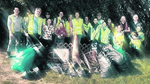 <p class="contextmenu internal_Caption">Volunteers enjoy some snacks in the sunshine after at the Douglas Tidy Towns litter pick and biodiversity walk at Doman’s Wood on Saturday.</p>