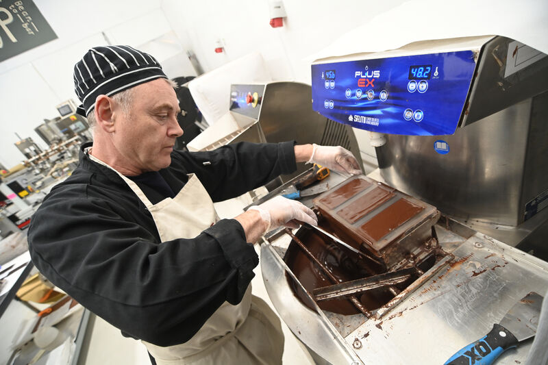  Paul O'Connell moulds chocolate bars after tempering, which makes the chocolate shelf stable , gives the bars a nice snap when cracked, and produces a bright sheen. Picture: Larry Cummins