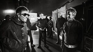 Liam and Noel Gallagher shown having a laugh in Oasis tour photography book