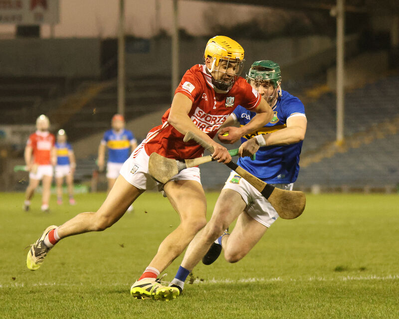 Cork's Johnny Murphy drives towards the Tipperary goal as Evan Morris chases him. Picture: Brendan Gleeson Cork's Johnny Murphy drives towards the Tipperary goal as Evan Morris chases him. Picture: Brendan Gleeson