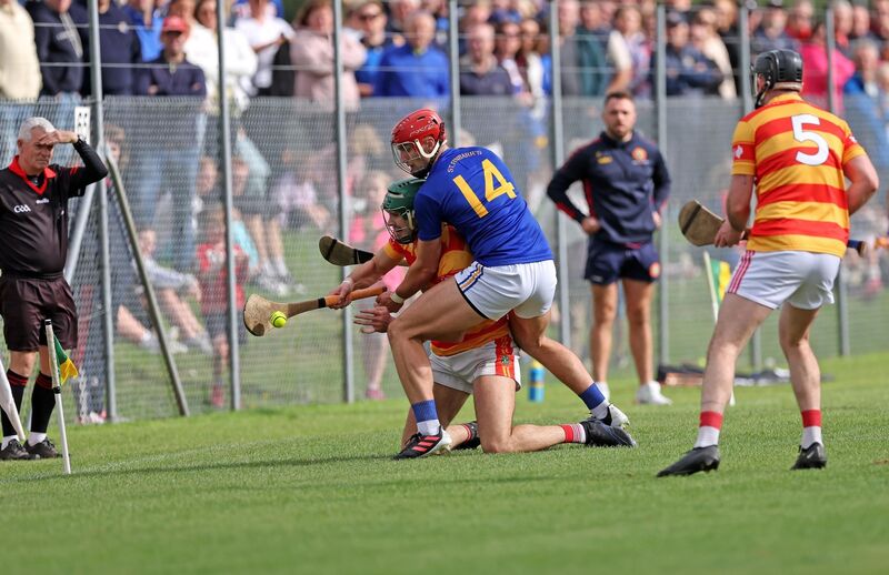  Brian Hayes, St Finbarr's, puts pressure on Sean O'Donovan, Newcestown, in the PSHC clash at Cloughduv in 2024. Picture: Jim Coughlan.