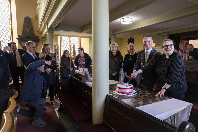 Lord Mayor of Cork, Cllr Fergal Dennehy, and Reverend Meghan Farr cutting a cake that was made by a member of the congregation. Picture: Clare Keogh Lord Mayor of Cork, Cllr Fergal Dennehy, and Reverend Meghan Farr cutting a cake that was made by a member of the congregation. Picture: Clare Keogh