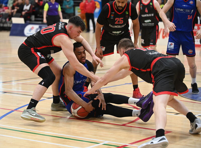 DRIVEN: Ballincollig's Dylan Corkery and Ronan O'Sullivan combine to tackle Éanna's Mikah Blackwell. Picture: Eddie O'Hare DRIVEN: Ballincollig's Dylan Corkery and Ronan O'Sullivan combine to tackle Éanna's Mikah Blackwell. Picture: Eddie O'Hare