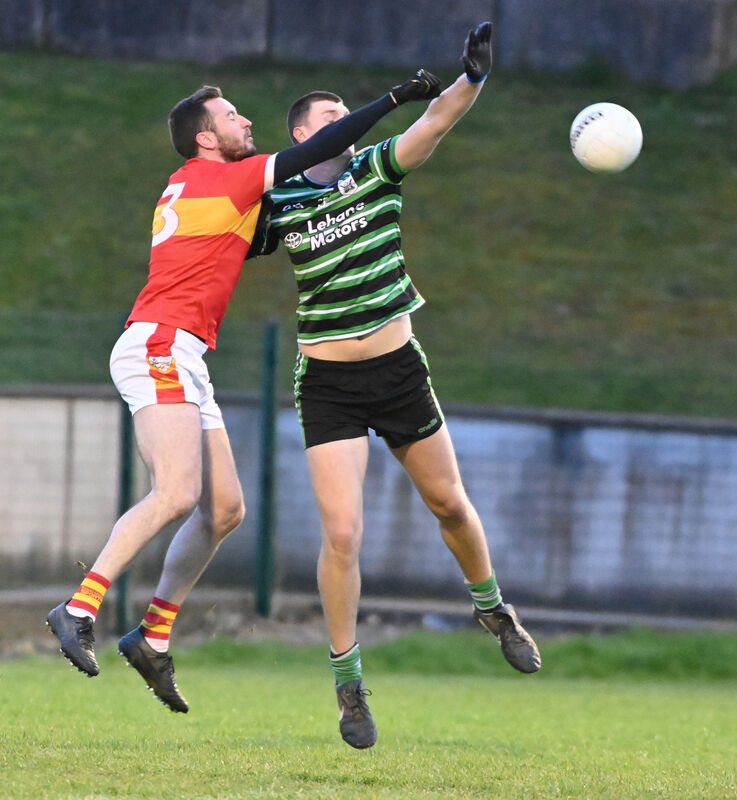 Douglas' Niall Hartnett and Éire Óg's Michael Corkery go high for the ball. Picture: Eddie O'Hare