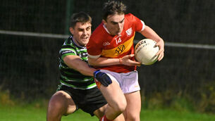 <p>PROMISING: Éire Óg's Sean Hurley wins the ball from Douglas' Niall Lynch during the McCarthy Insurance Group SFL Division 1 game at Ovens. Picture: Eddie O'Hare</p>