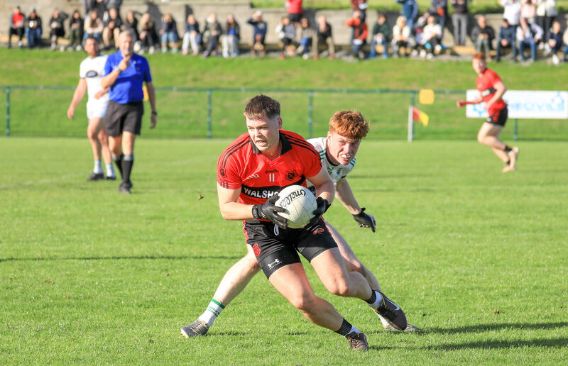 Mitchelstown's Cathail O'Mahony turns Ilen Rovers' Seán Connolly last year. Picture: David Creedon