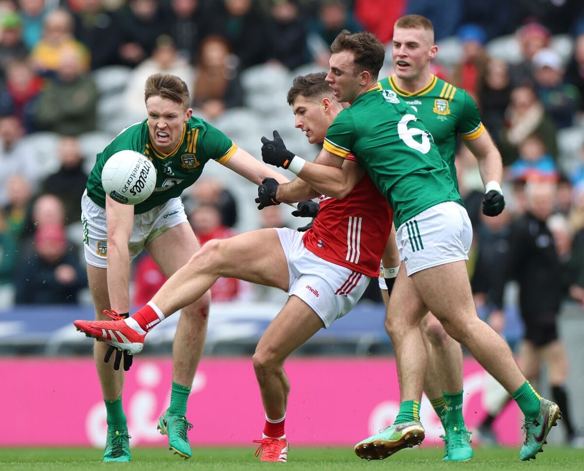 Meath’s Cian McBride, Jack Flynn and Seán Coffey attempt to stop Seán McDonnell of Cork. Picture: INPHO/James Crombie