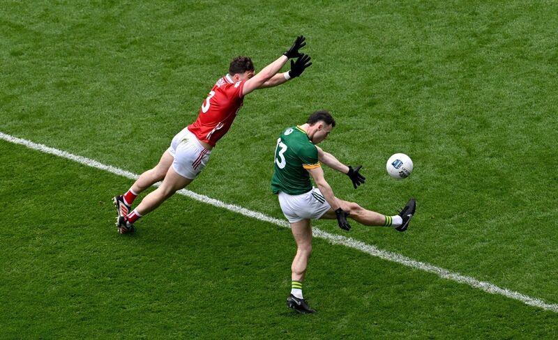 Jordan Morris of Meath in action against Daniel O'Mahony of Cork. Picture: Ramsey Cardy/Sportsfile