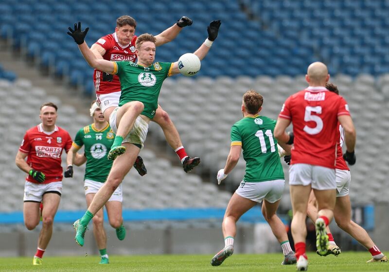 Cork's Colm O'Callaghan and Cian McBride of Meath battle for the ball. Picture: INPHO/James Crombie