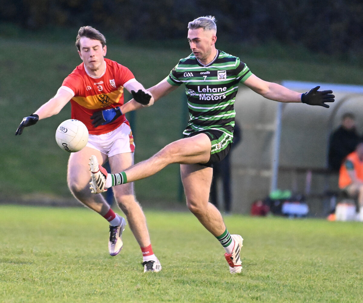 Eire Og's Oisin O'Shea blocks down this shot by Douglas' Conor Kingston. Picture: Eddie O'Hare