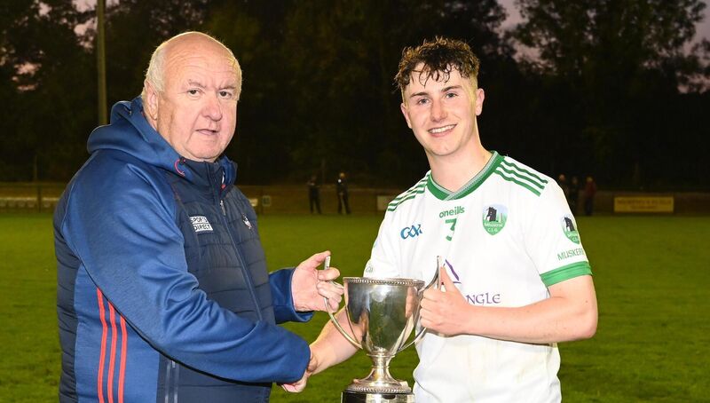 Noel O'Callaghan, Cork County Board, presents the Tadhg Crowley trophy to Muskerry captain Eoghan Lehane in 2024. Picture: Eddie O'Hare