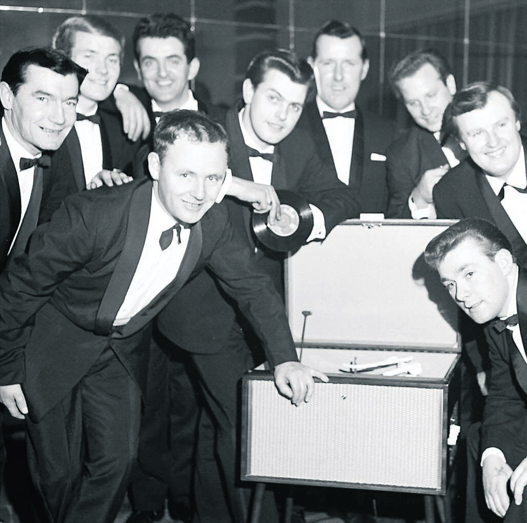 The Regal Showband, Cork, listen to their first recording, Love Me, in November, 1964, with their manager Paddy Kennedy and band leader John Minehane The Regal Showband, Cork, listen to their first recording, Love Me, in November, 1964, with their manager Paddy Kennedy and band leader John Minehane