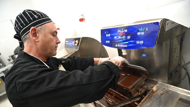 <p> Paul O'Connell moulds the bars after tempering at Tory Top Chocolate. Picture: Larry Cummins</p>