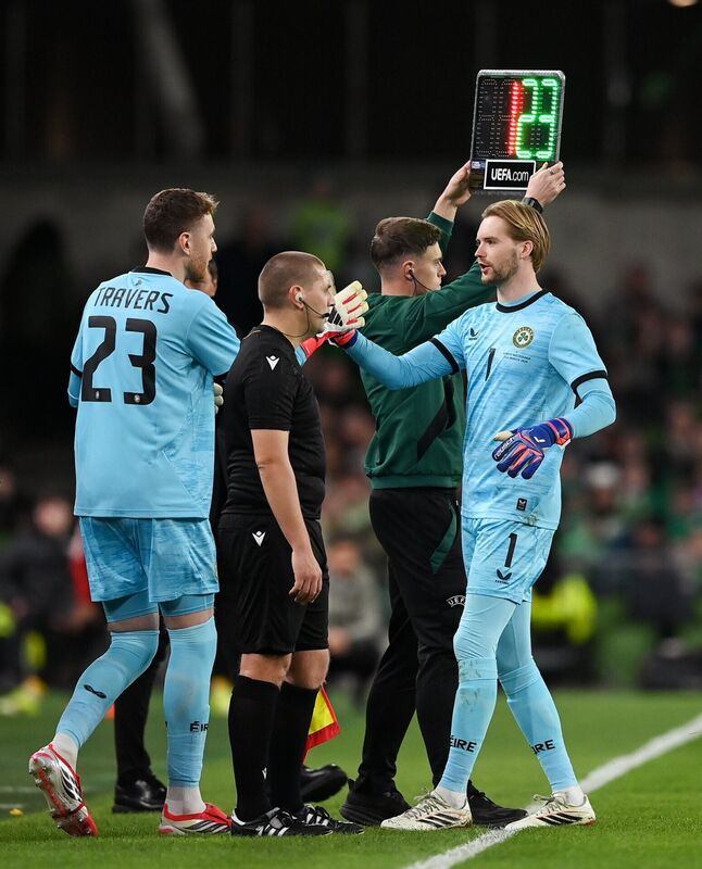 Republic of Ireland goalkeeper Mark Travers, left, comes on as a substitute to replace teammate Caoimhin Kelleher during the international friendly match between Republic of Ireland and North Macedonia at Aviva Stadium in Dublin. Photo by Stephen McCarthy/Sportsfile
