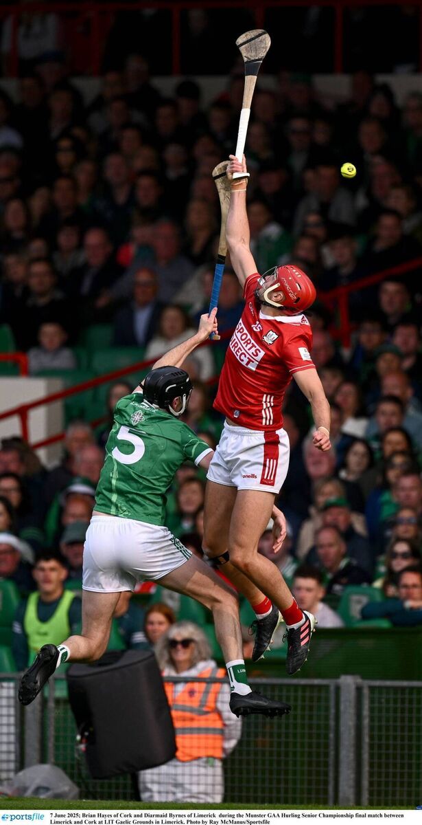Brian Hayes of Cork and Diarmaid Byrnes of Limerick rise high for a puck-out. Picture: Ray McManus/Sportsfile