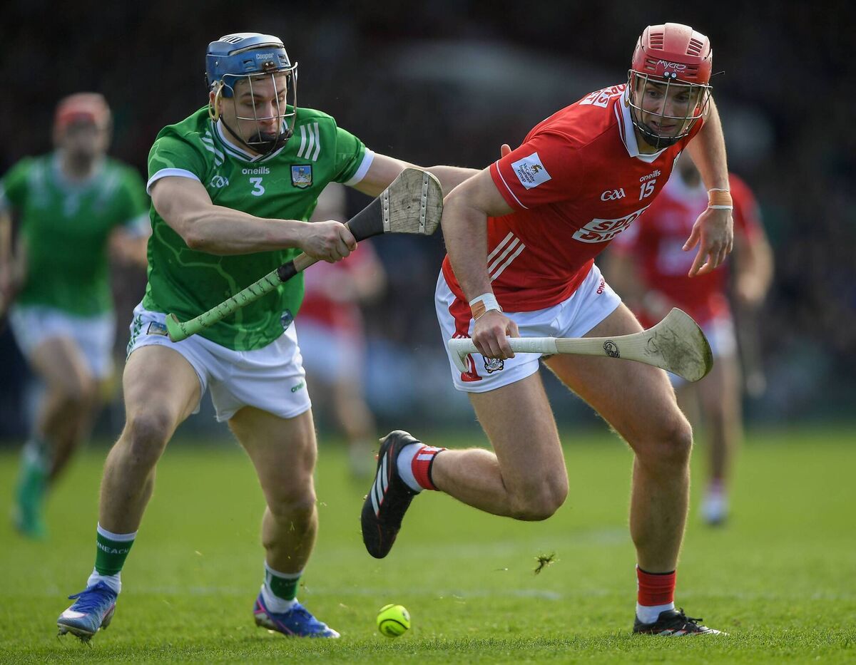 Brian Hayes of Cork battles Mike Casey of Limerick. Picture: John Sheridan/Sportsfile
