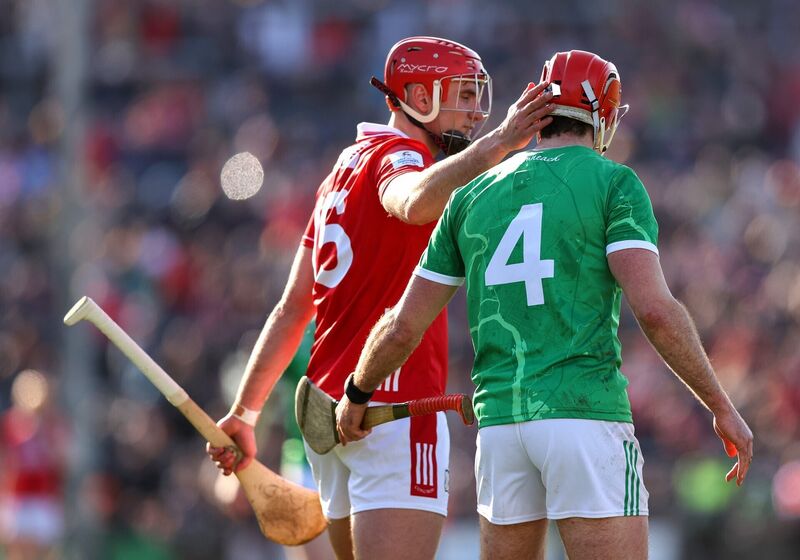 Cork's Brian Hayes and Barry Nash of Limerick after the game on Sunday. Picture: INPHO/Tom O’Hanlon