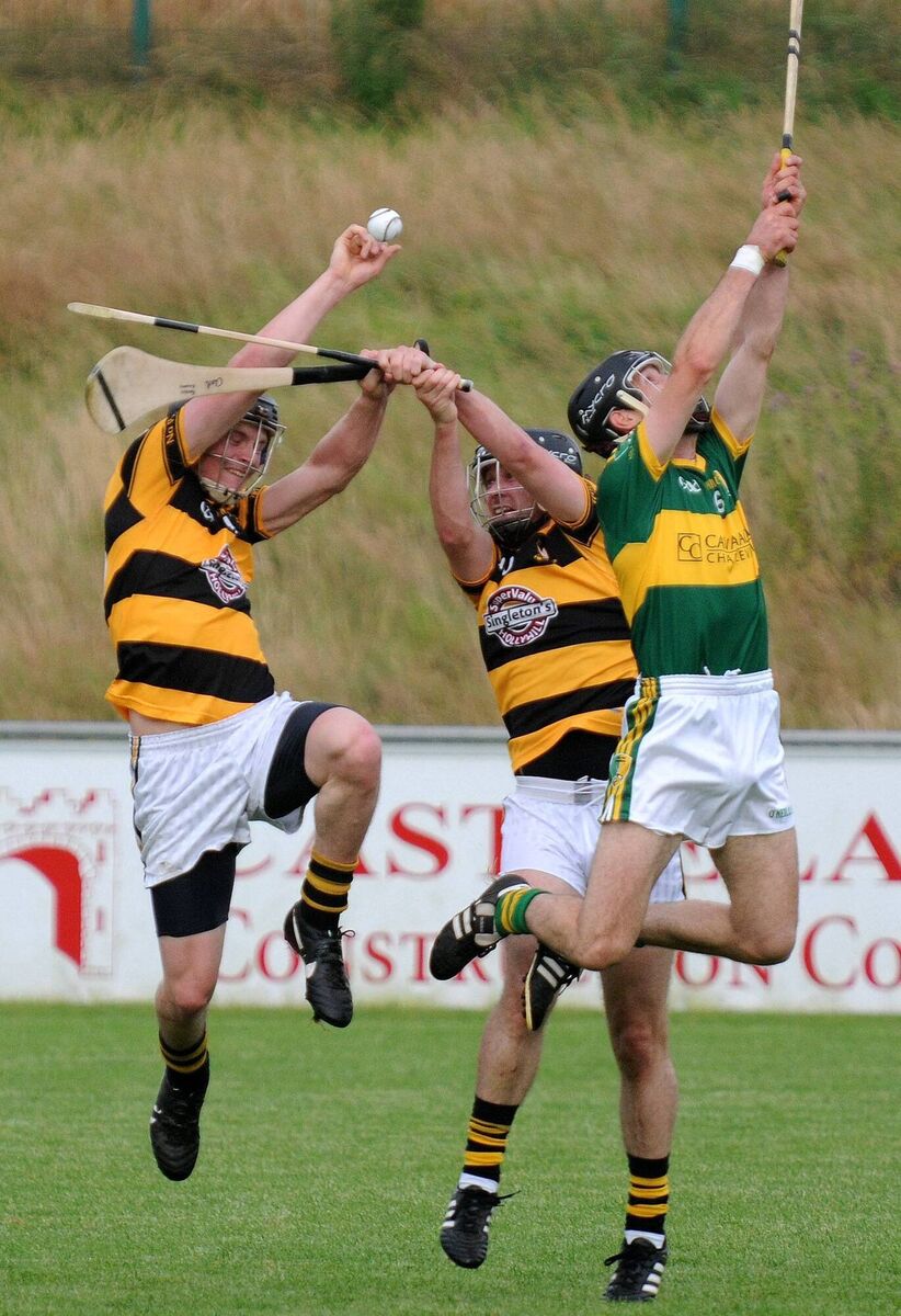 Na Piarsaigh's Stephen Glasgow and Pa O'Rourke battle for the sliotar with Newtown's Ben O'Connor in 2012. Picture: David Keane.